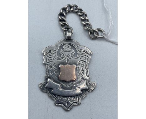 A large fancy silver and gold watch fob on small link albert 17 gms