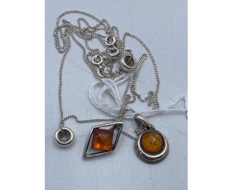 Two silver amber necklaces
