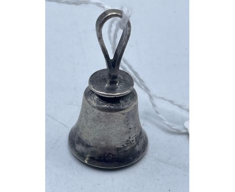 A small silver hand table bell