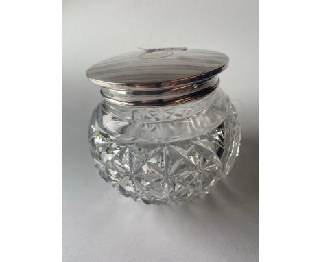 Silver topped dressing table jar with glass body. 3.5in diam . Birmingham 1914. 45gms