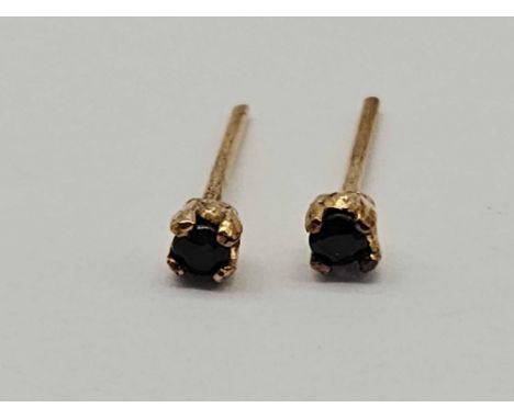 A pair of amethyst stud earrings 9ct