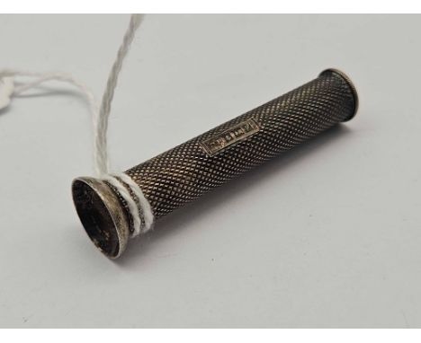 A silver cigar piercer