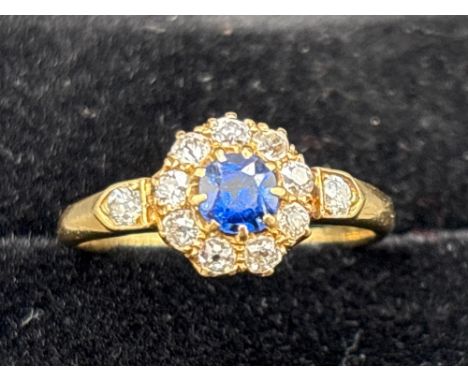 A vintage sapphire and diamond cluster ring 18ct gold size N 2.5 gms