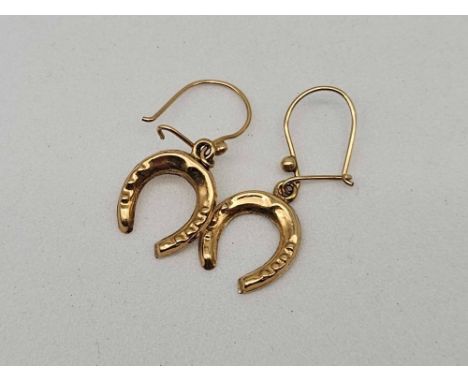 A pair of horse shoe drop earrings 9ct 1.3 gms