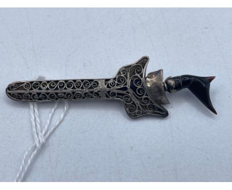 A silver and ebony Arabic dagger brooch