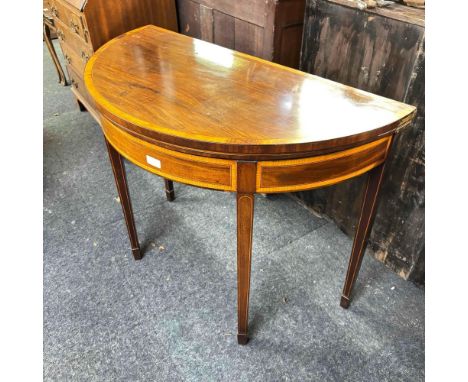 A Georgian semi circular folding top card table mahogany with satin wood banding