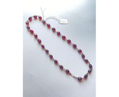 A cherry amber twenty four bead necklace