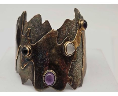 A stylish stone set silver bangle 75 gms