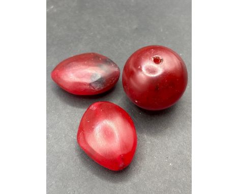 Three large cherry amber beads 30.5 carats