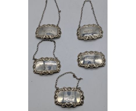 A collection of silver decanter labels, Vodka, Scotch, Martini, Sherry, Port, hallmarked London, maker DJS, 48g, W.7cm