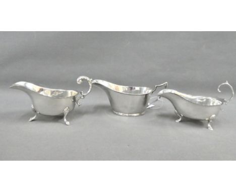 Three silver sauce boats to include Walker &amp; Hall, Sheffield 1929, John Round &amp; Son  Sheffield 1927 and another Birmi