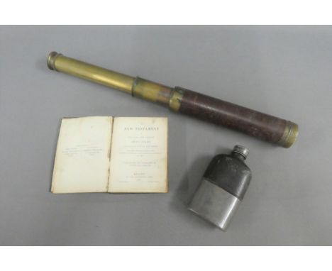 19th century leather and brass telescope, a pewter mounted hip flask and a copy of The New Testament, (3) 