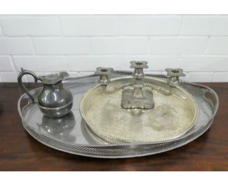 A lot to include one silver plated tray, one white metal tray, a silver plated teapot and candlestick (a lot) 