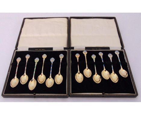 Two cased sets of silver gilt and enamel coffee spoons, Birmingham 1979