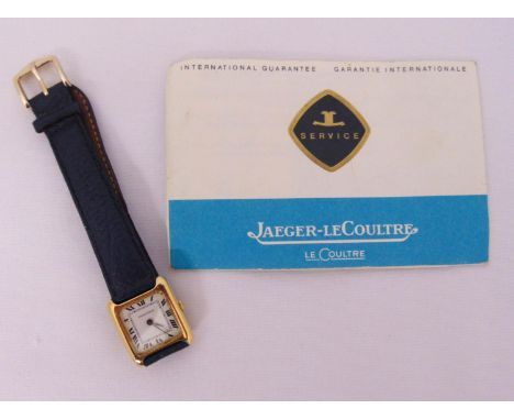 Jaeger LeCoultre 18ct gold ladies wristwatch with white enamel dial and Roman numerals on replacement leather strap