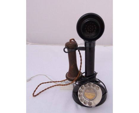 An early 20th century stick telephone of customary form on raised circular base (converted for modern use)