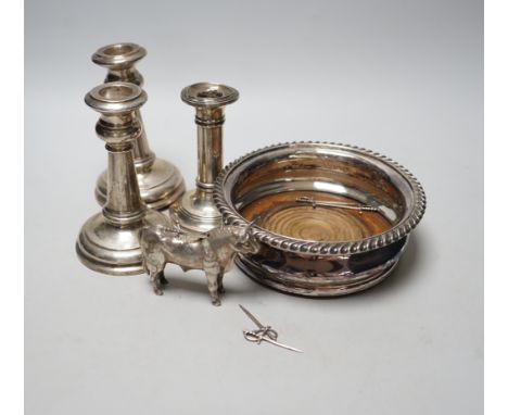 A pair of early 20th century silver mounted dwarf candlesticks, marks rubbed, height 13.2cm (a.f.), one other silver mounted 