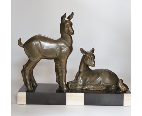 An Art Deco patinated spelter twin goat group on marble base, etched ‘Rochard’ on base, 36cm high