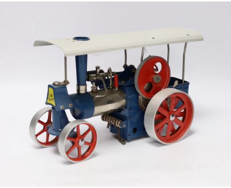 A boxed Wilesco ‘Old Smoky’ live steam traction engine (D40) and two accessories; a circular saw (M53) and a two-wheel grinde