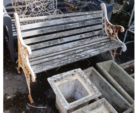 A Victorian style painted cast iron slatted garden bench, length 128cm, depth 68cm, height 78cm