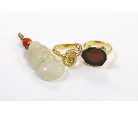 A yellow metal and coral bead mounted carved jade pendant, overall 49mm, a 1970's 18ct gold and tourmaline? set modernist rin