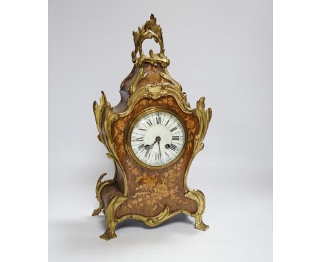 A French gilt metal mounted rosewood mantel clock. 40cm