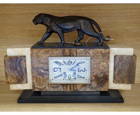 An Art Deco onyx and spelter mounted ‘panther’ mantel clock, 49.5cm wide