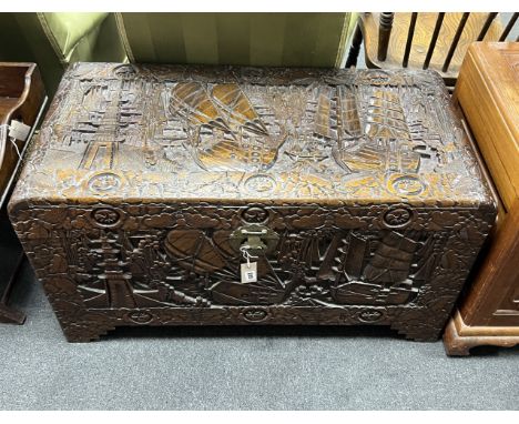 An Asian relief carved sandalwood trunk, length 97cm, depth 48cm, height 54cm