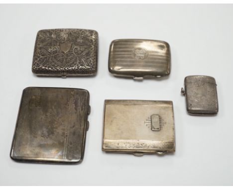 Three assorted silver cigarette cases including Art Deco, largest 10.1cm, a silver vesta case and a white metal cigarette cas