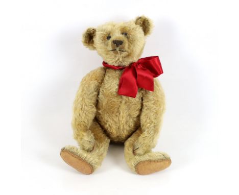 An early Steiff, c.1908, 40cm, no button, in very good condition, replaced paw pads