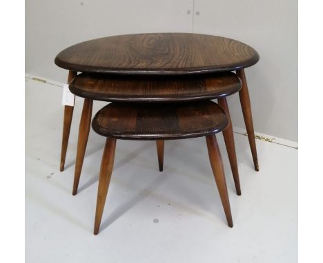 A nest of three Ercol tables, width 64cm, depth 44cm, height 40cm