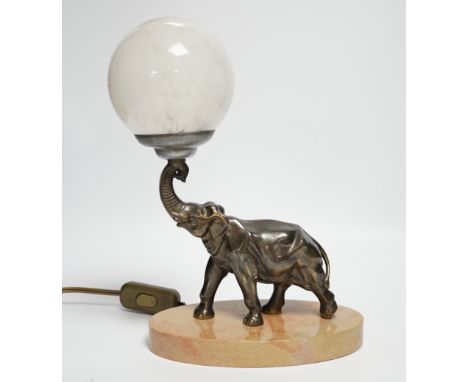 An Art Deco spelter elephant table lamp with glass globe shade, 27cm high