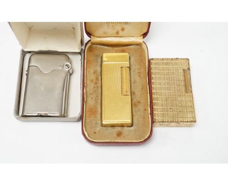 A cased Dunhill lighter, a DuPont lighter and a Thorens lighter