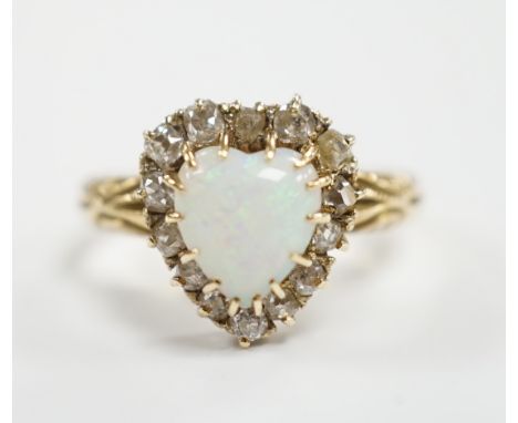 A yellow metal, white opal and diamond set heart shaped cluster ring, size N, gross weight 3.7 grams.