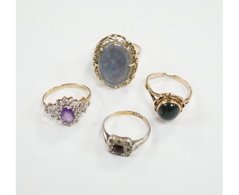 Two 9ct and gem set rings including cabochon bloodstone, a 14k and opal? doublet set ring and one other ring.