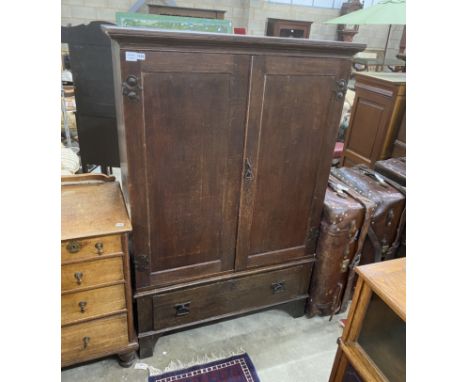 A late 18th century oak hanging cupboard, with later Art Nouveau hammered copper hinges, width 116cm, depth 50cm, height 173c