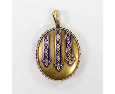A Victorian engraved yellow metal, enamel and seed pearl set oval locket, overall 45mm, gross weight 14.1 grams.