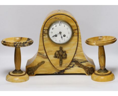 An early 20th century French Sienna marble clock garniture, 30cm