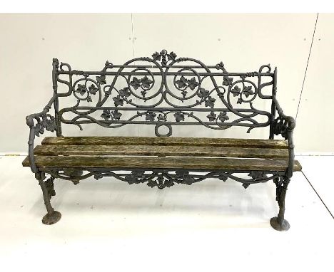 A Victorian black painted Coalbrookdale cast iron ivy pattern garden bench, length 147cm, depth 52cm, height 89cm