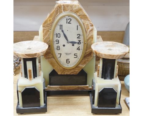 An Art Deco onyx and marble clock garniture, clock 42cms high