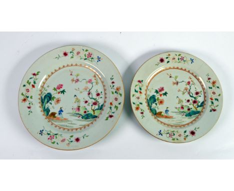 TWO LATE EIGHTEENTH/ EARLY NINETEENTHN CENTURY CHINESE FAMILLE ROSE PORCELAIN PLATES, each painted in colours with a matching