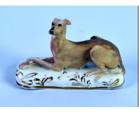 GRAINGER. LEE &amp; Co, WORCESTER PORCELAIN MODEL OF A RECUMBENT GREYHOUND, painted in matt tones of brown and modelled on an