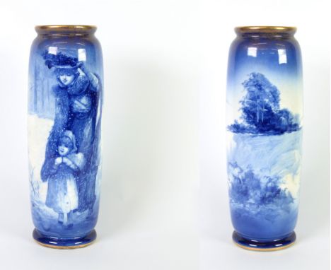 ROYAL DOULTON BLUE AND WHITE CHINA VASE, of footed, cylindrical form with gilt dusted rims, decorated with a mother and child