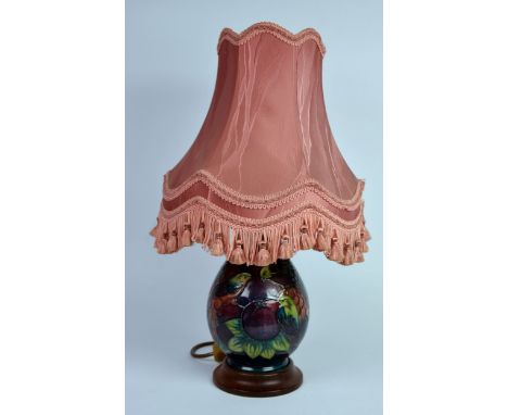 MOORCROFT: MOORCROFT POTTERY LAMP BASE IN THE FINCHES WITH FRUIT TO A GREEN OMBRE PATTERN and associated shade, the base appr