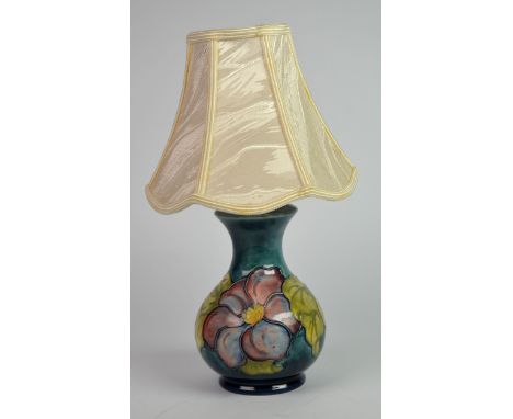 MOORCROFT: MOORCROFT POTTERY CLEMATIS TO A BLUE OMBRE GROUND LAMP BASE with associated shade, 9in (23cm) high, the base 