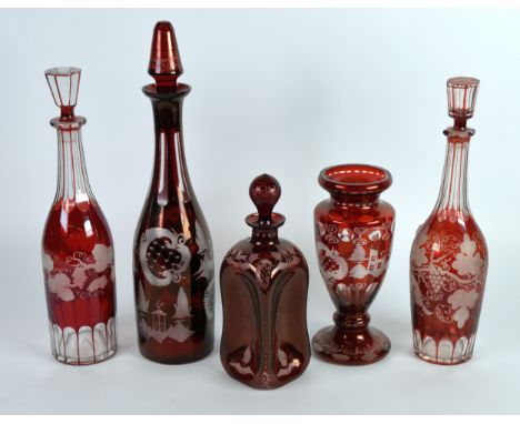 RUBY GLASS, a collection of 19th century ruby flash glass with etched grape and vine decoration including a pair of bottle de