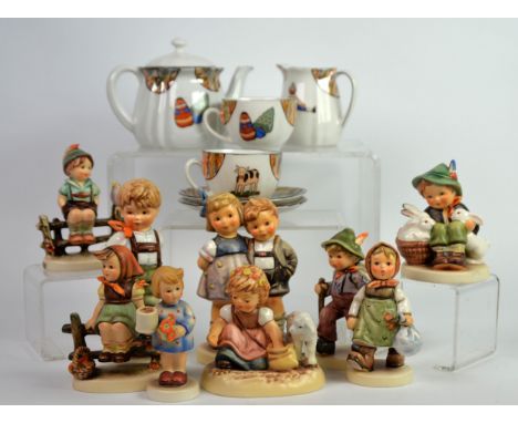 GOEBEL HUMMEL: Nine Hummel figure groups, mostly late 20th century though with some earlier examples, (12.5 cm) 5 ½” and smal