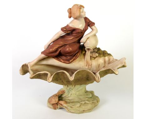 ROYAL DUX FIGURAL PORCELAIN PEDESTAL BOWL, painted in muted tones and gilt, and modelled a as a reclining maiden surmounting 