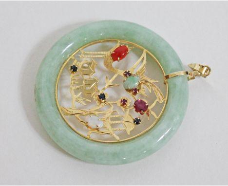 A Chinese yellow metal, jade and multi gem stone pendant, marked '18K750', diam. 4.8cm, gross wt. 20g.