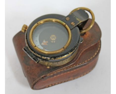 A compass with leather case.